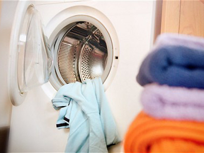 Washing machine with yellow towel